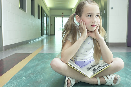 Image of Student sitting in hallway