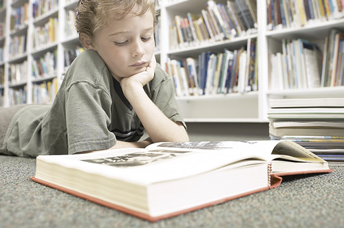 Student reading book 