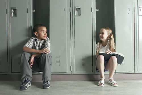 students in front of lockers 