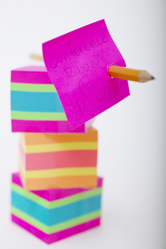 stack of post-it notes and pencil 