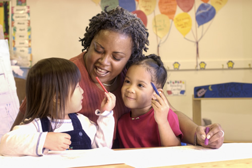 photo of a woman with two students 