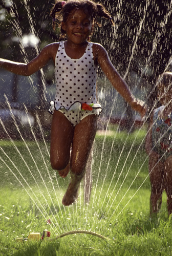 child in sprinkler